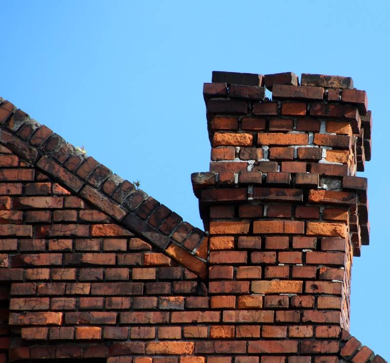Signs Your Chatsworth Home Needs a Chimney Inspection Damaged chimney on an Chatsworth home showing cracks and missing mortar